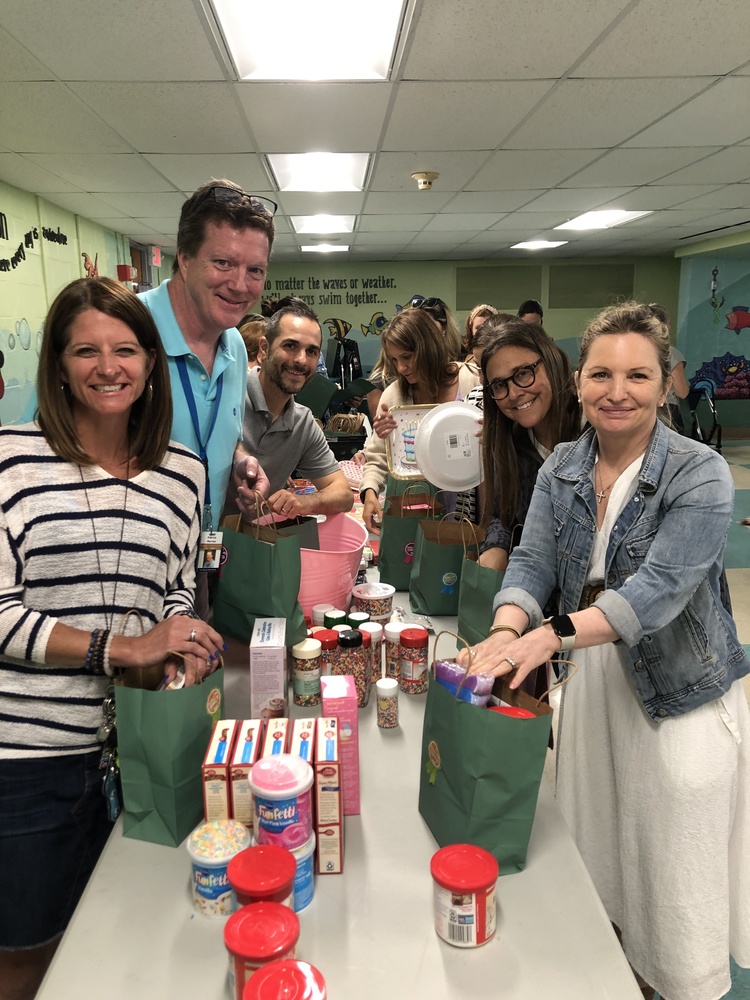 Teachers assemble birthday bags at West 