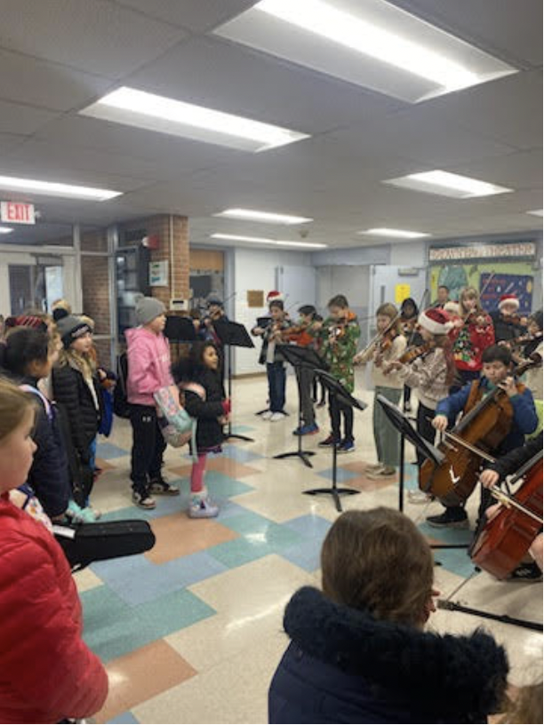 Saxe Orchestra Performs Holiday Music for West Students