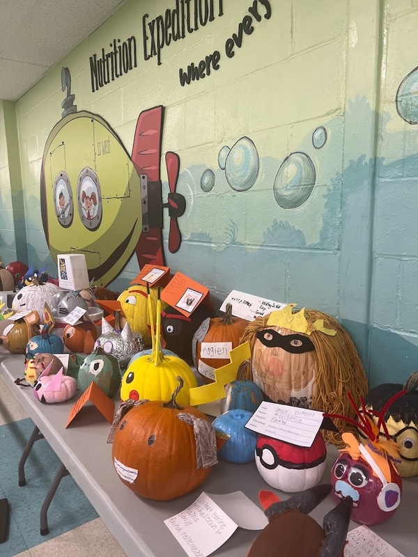 Other half of the table of book character pumpkins